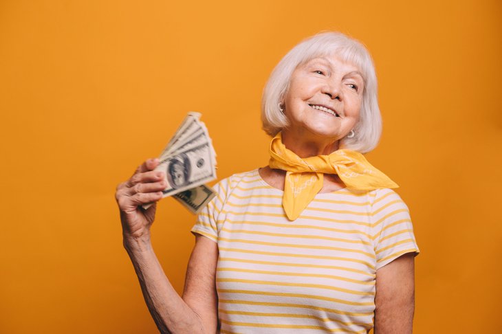 Senior woman holding money