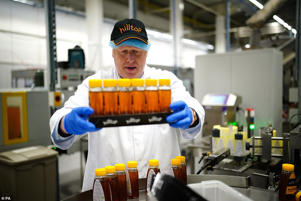 The Government is under growing pressure to act after it was announced this week that inflation had hit 9 per cent – the highest rate for 40 years. Pictured: Prime Minister Boris Johnson during a visit to Hilltop Honey in Powys, Wales, on Friday