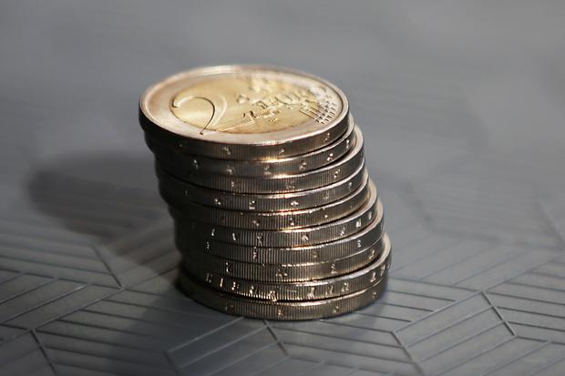 Setting aside two euro coins can be a fun, tangible way to see your savings grow. Photo: Getty Images